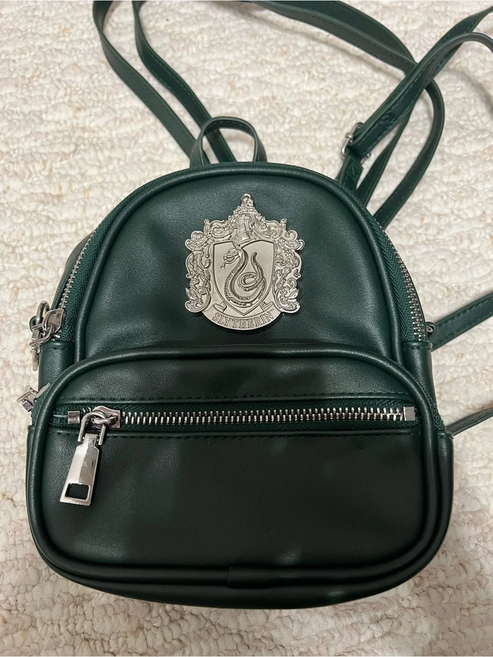 Dark Green Mini Backpack with Silver Crest Detail